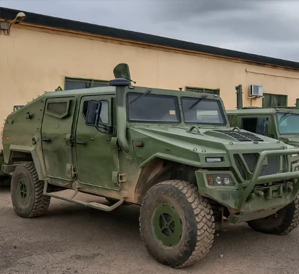 Armored military vehicle designed for troop transport and tactical missions in rugged terrains.