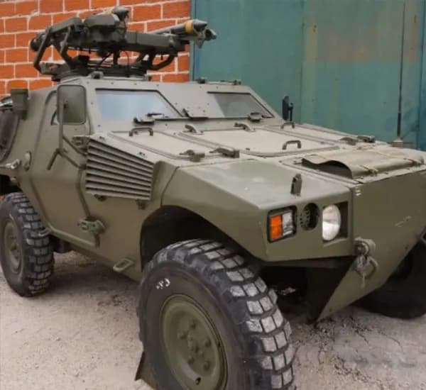 Armored military vehicle equipped with mounted weapon system for tactical defense and combat missions.