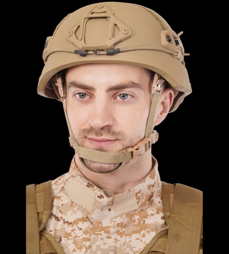 Front view of a man wearing a tan mid-cut tactical helmet with NVG mount and secure chin strap.