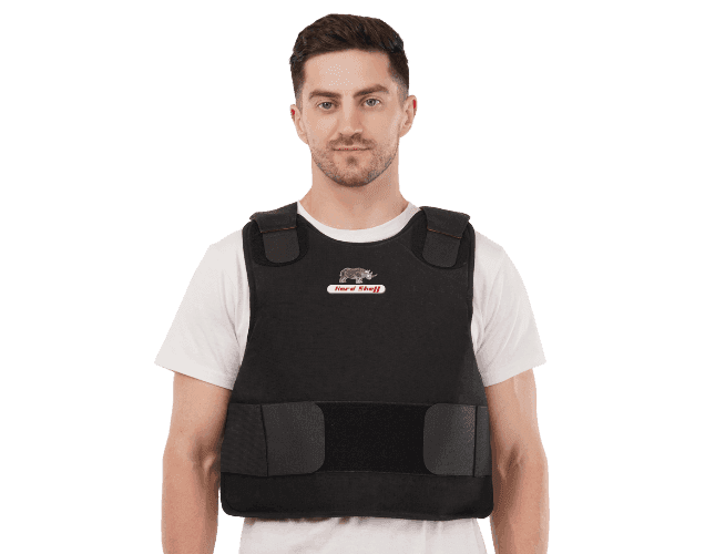Model wearing Hard Shell black concealable vest - low pro designed for lightweight ballistic protection and concealed security use.