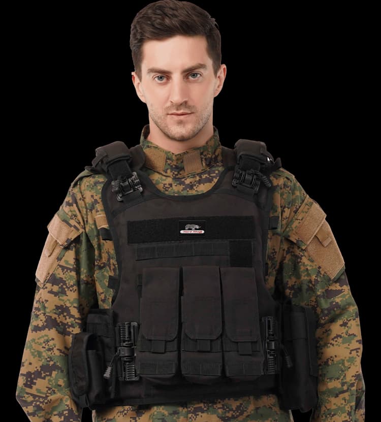 Man wearing Hard Shell Rhino Tactical Vest showcasing multi-pocket front layout and rugged field-ready build.